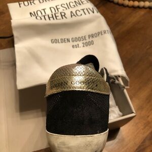 Designer Golden Goose Sneakers. Worn 5  or 6 times. All original packaging